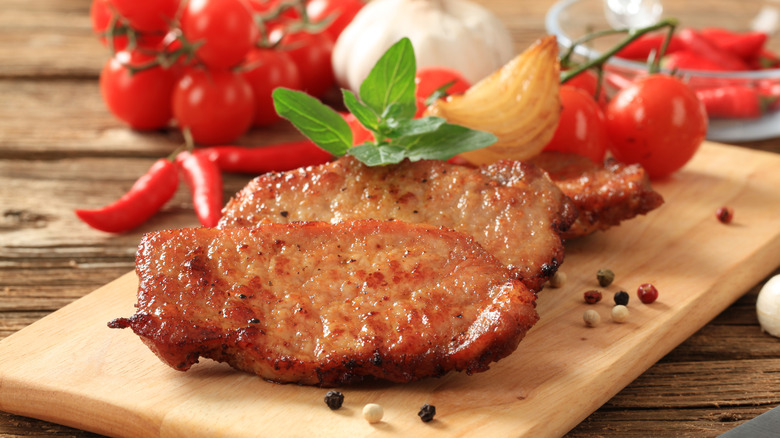 pork chops marinating with tomatoes