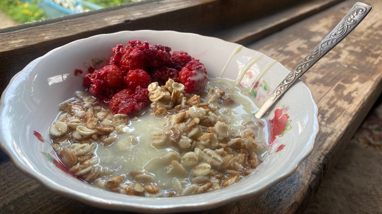 Oatmeal with condensed milk and raspberries