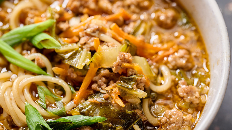 closeup of ground pork in soup