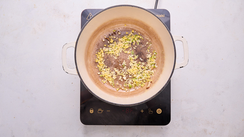 cooking garlic and ginger in pot