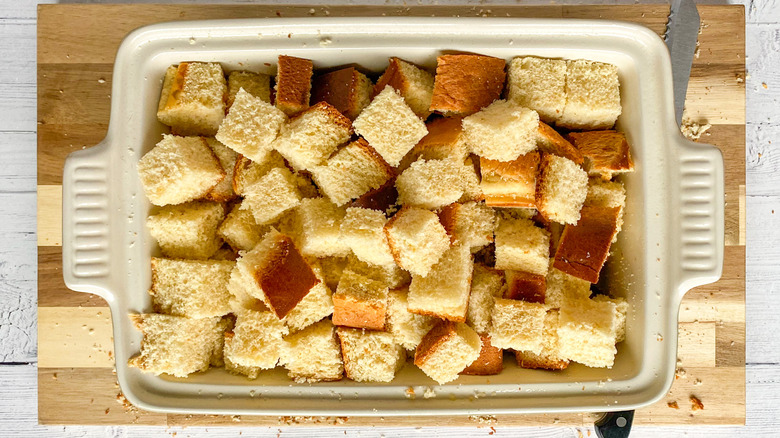 cubed bread in baking dish