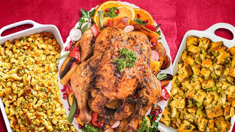 table with turkey with stuffing and side dishes