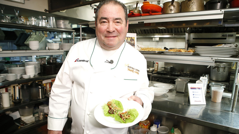 Emeril Lagasse with meal in kitchen