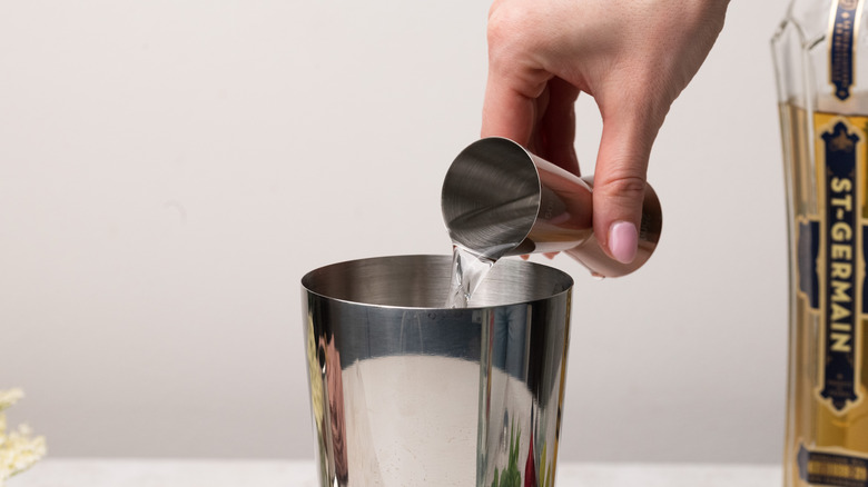 Pouring alcohol into a shaker