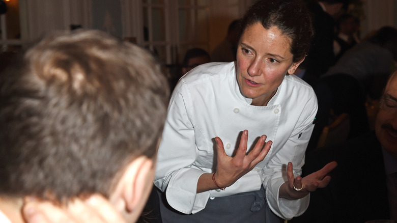 Elena Reygadas speaking in chef uniform