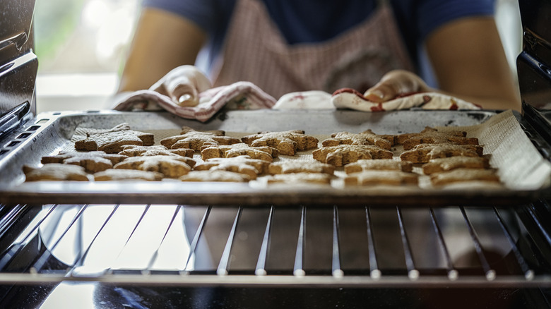 taking cookies out of oven