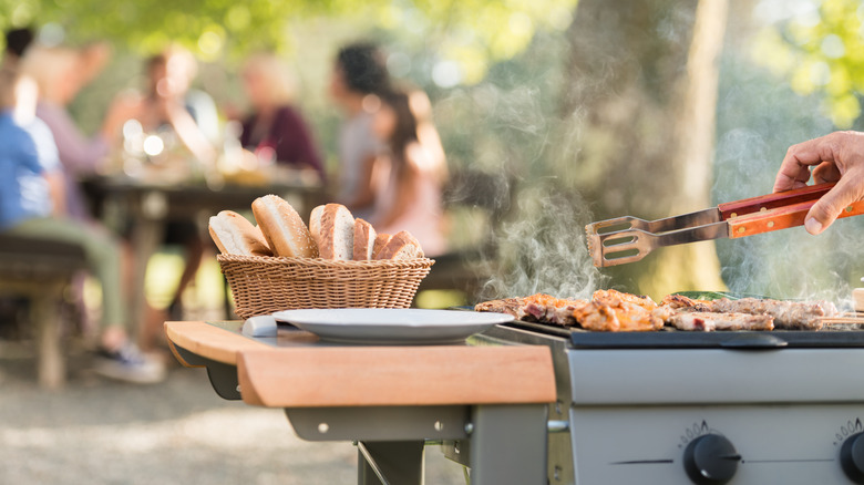 Basket of bread by grill 