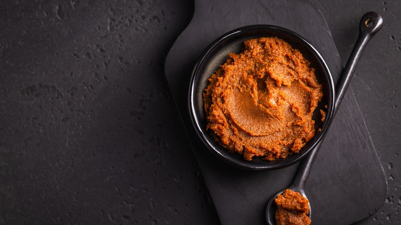 Miso paste in black bowl