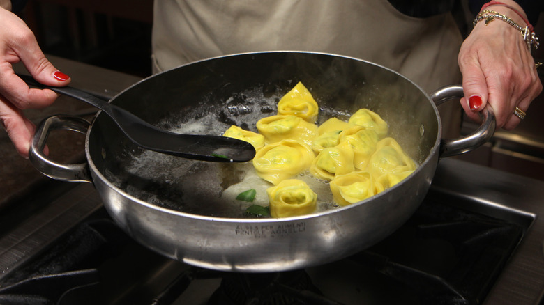 Tortellini cooking in pan 