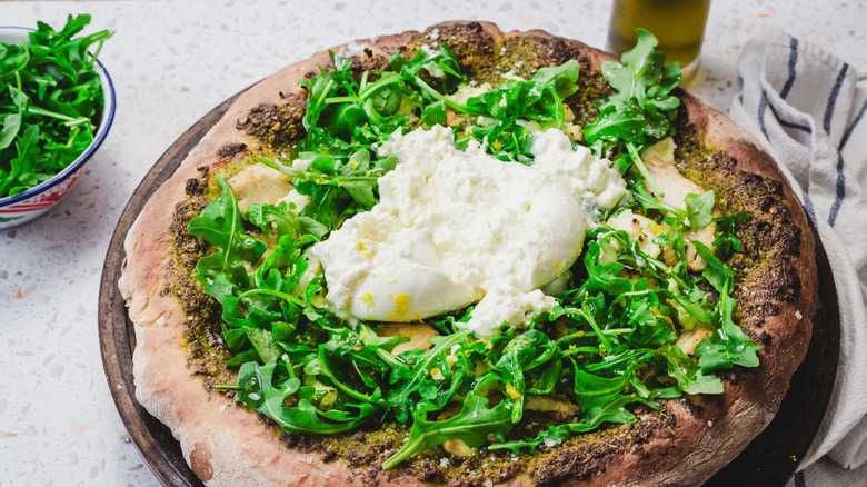 Pizza with torn burrata on top