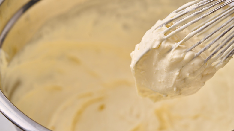 whisking pudding in bowl