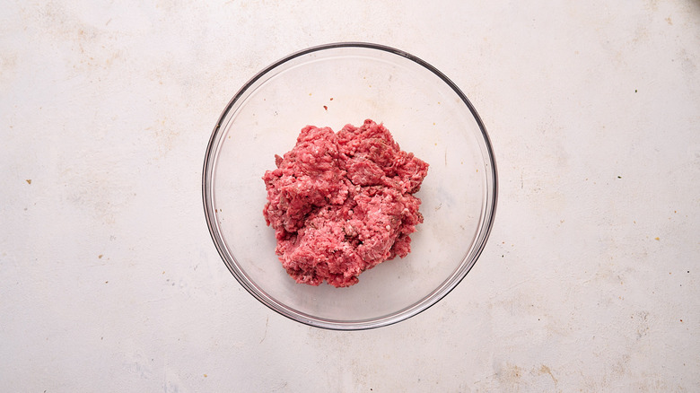 mixing patty meat in bowl