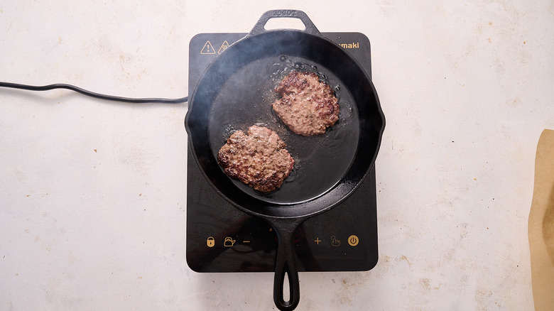 searing burgers in skillet