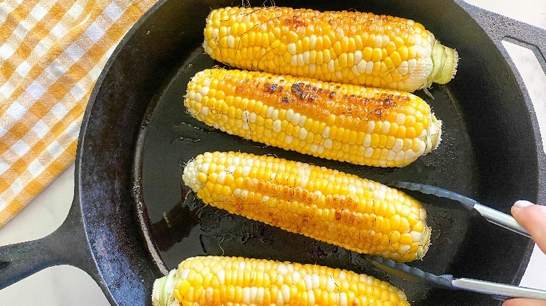 corn cooking in cast iron skillet