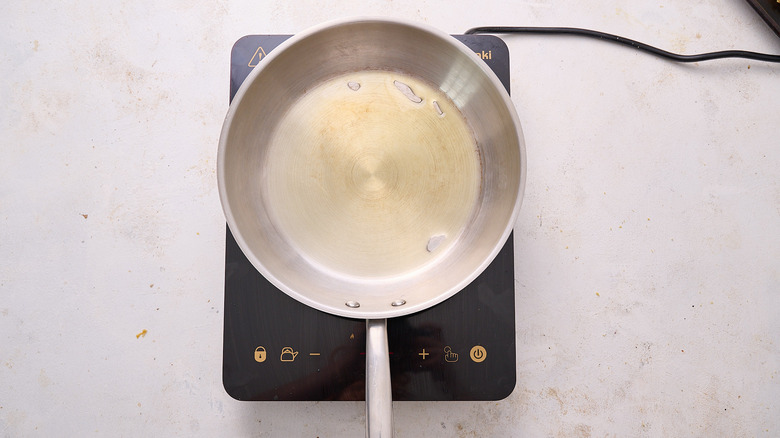 heating oil in skillet