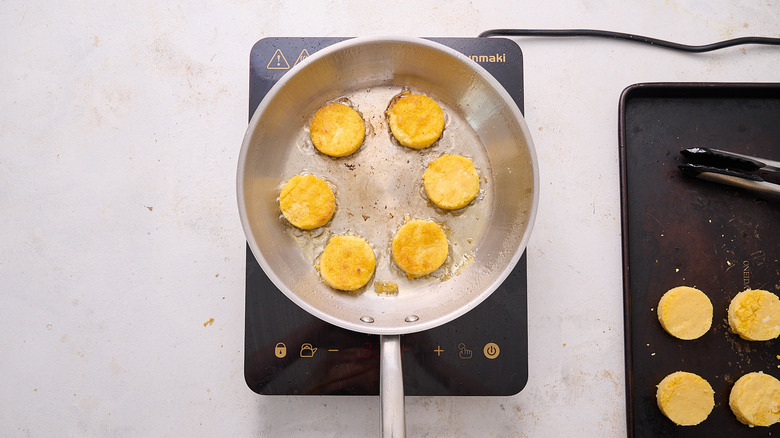 browning polenta cakes in skillet