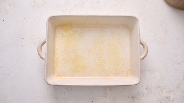 greasing a baking dish with oil