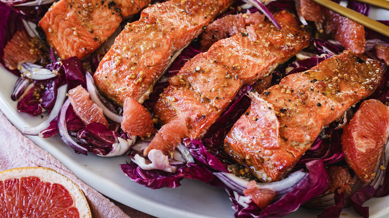 salmon with orange, fennel and rice on platter