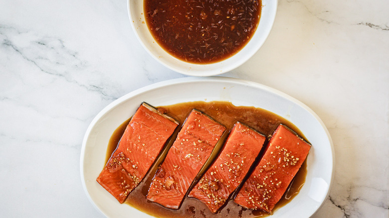 Salmon beside marinade