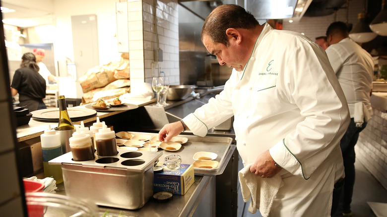 Emeril Lagasse prepares dishes