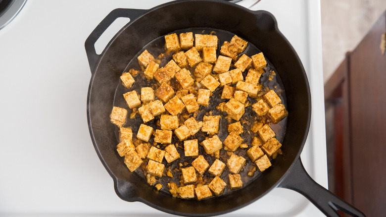 cast iron pan cooking tofu shawarma