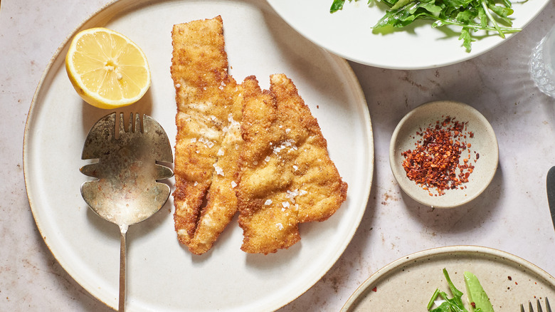 flounder and lemon on a plate