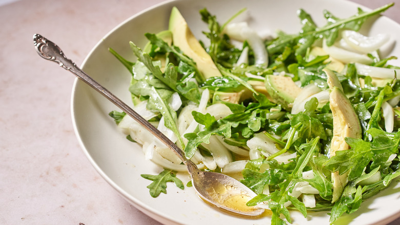 arugula and avocado in bowl