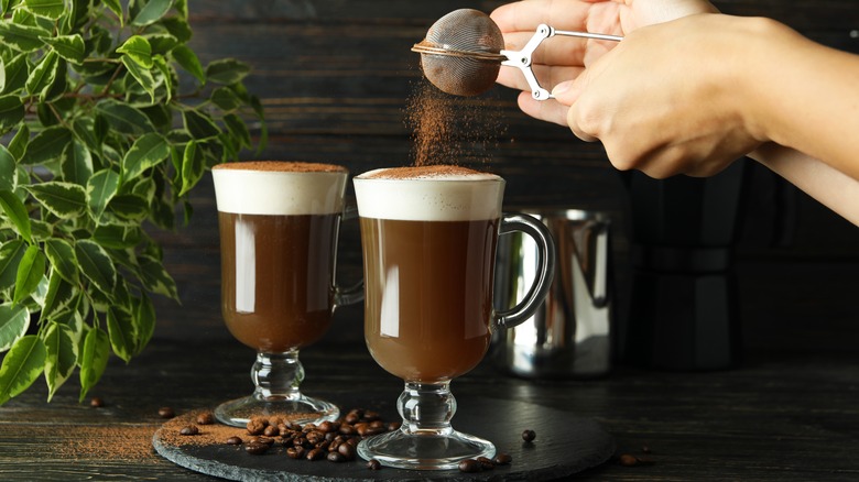 Warm Irish coffee in glasses 