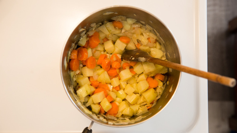 colorful vegetables cooking in saucepan