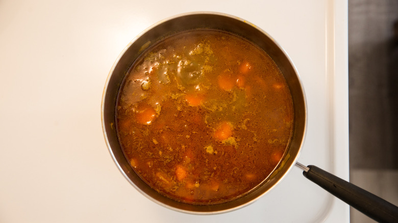 liquidy stew cooking on stove