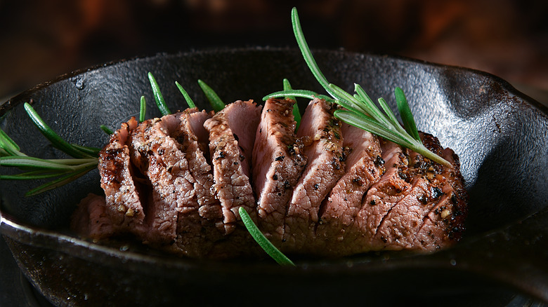 Seared boar in a cast iron pan