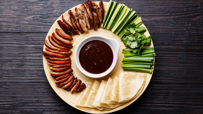 sliced Peking duck with condiments