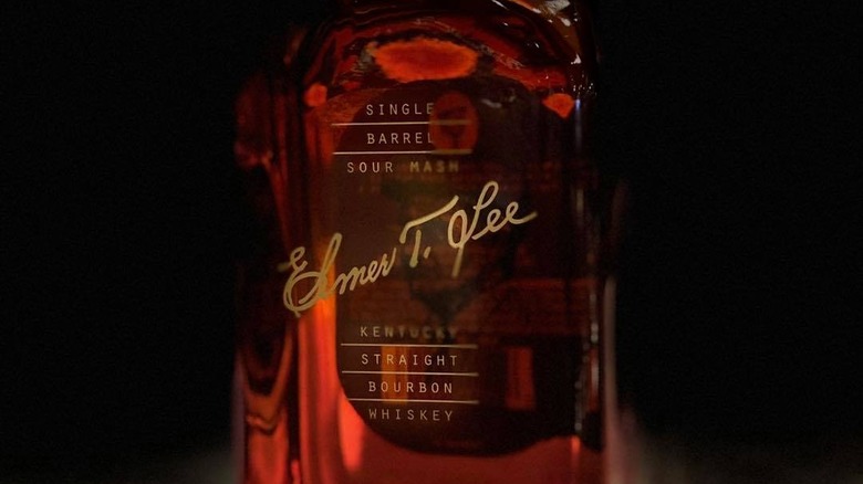 Bottle of Elmer T. Lee in shadows