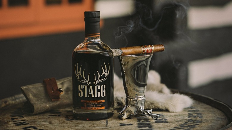 Stagg bourbon bottle with cigar