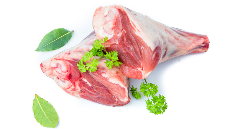 Two raw lamb shanks