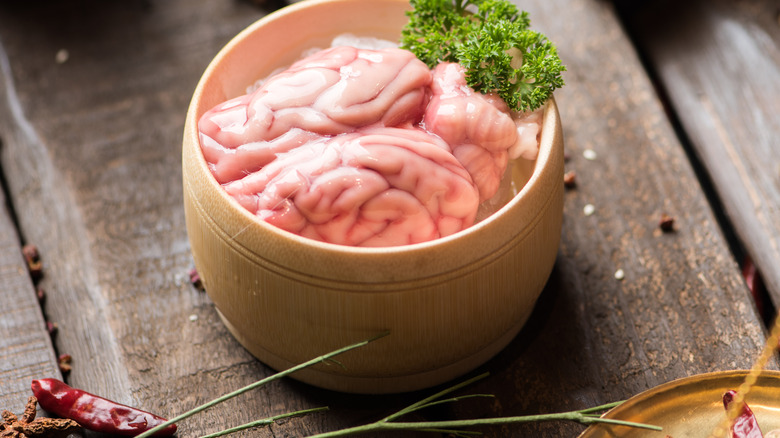 raw pork brain in ceramic dish