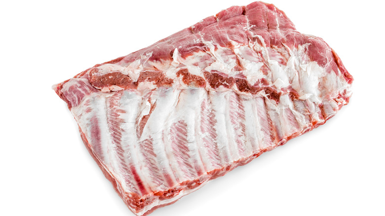 raw spareribs on white background