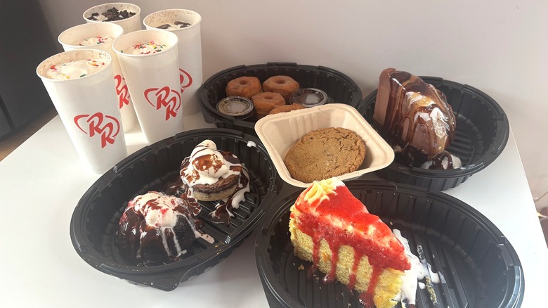 Array of Red Robin takeout desserts on white table