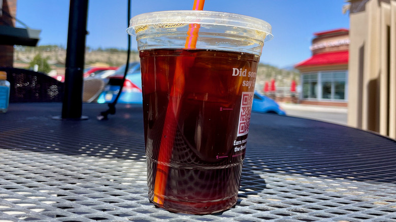 Blueberry iced coffee on metal table