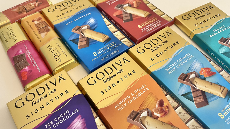 A selection of different Godiva chocolate bars is shown.
