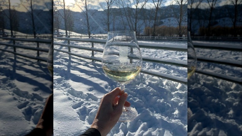 Glass of chardonnay in snow