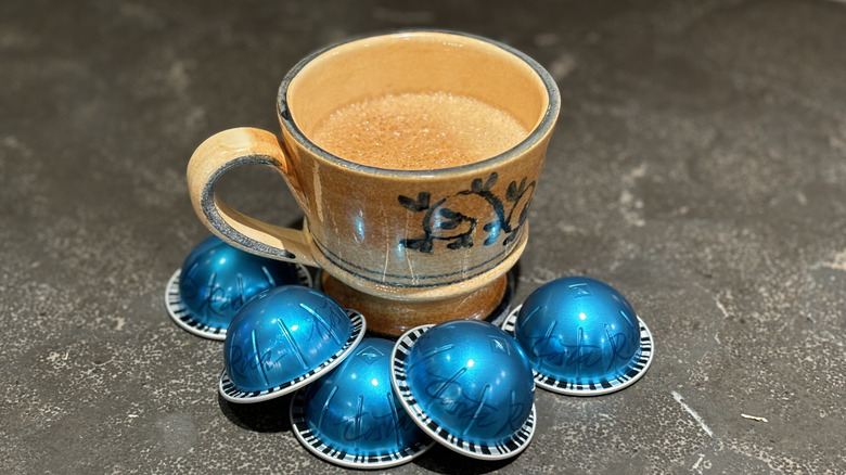 Cup of coffee with blue Nespresso Costa Rica pods