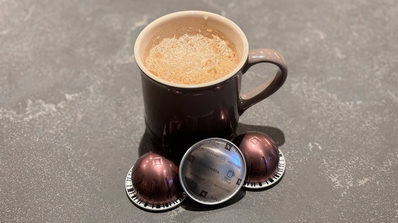 Coffee cup with bronze Nespresso Columbia pods