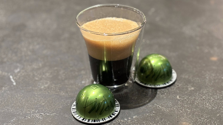 Cup of coffee with green Nespresso Mexico pods