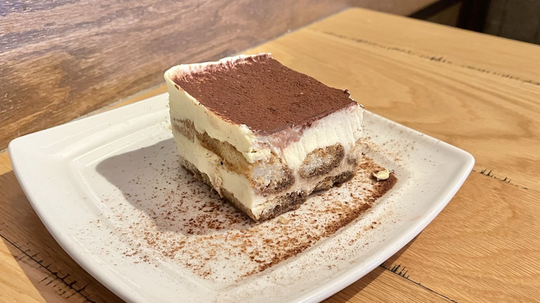 A slice of Olive Garden tiramisu on a white plate