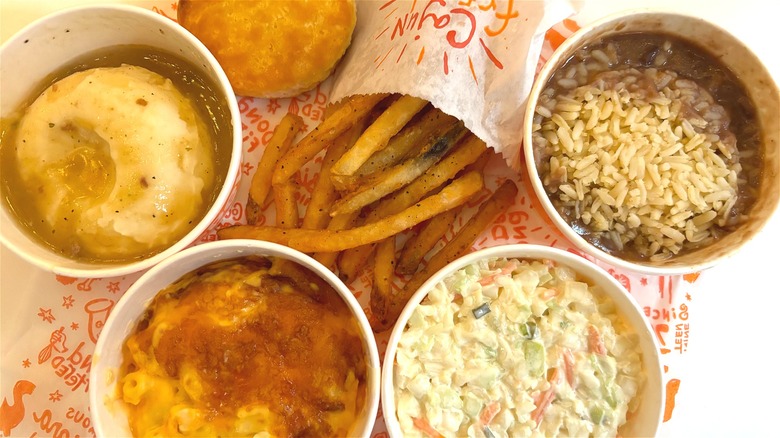 Overhead shot of five Popeyes sides on Popeyes wrapper