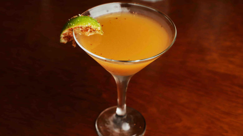 Orange cocktail in a martini glass