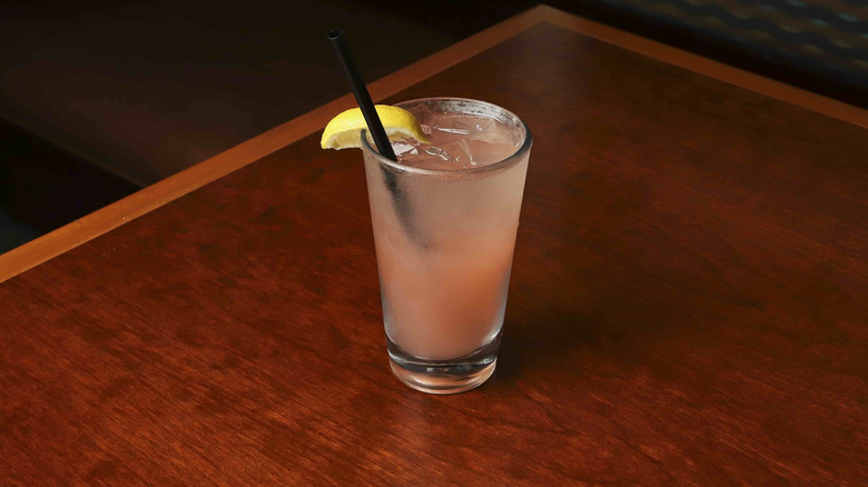 Pink drink in a pint glass