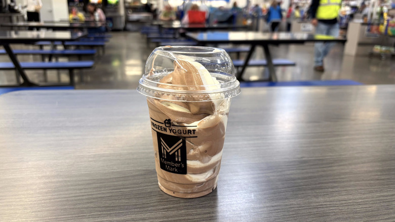 Sam's Club chocolate and vanilla swirl frozen yogurt in plastic cup on table in food court