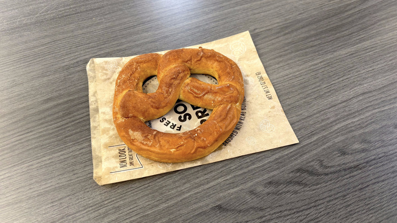 Sam's Club cinnamon sugar pretzel on paper sack on table